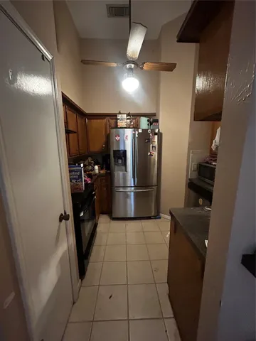 a kitchen with refrigerator and washer