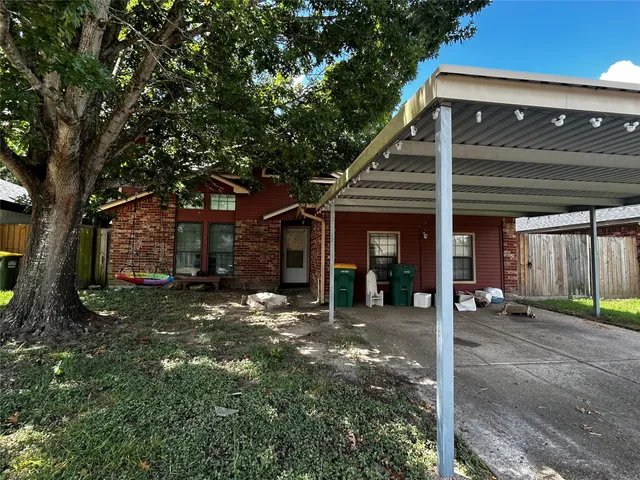 a view of a house with a tree