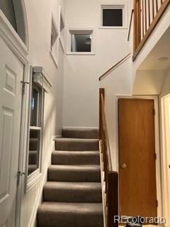 133 South Jackson Street, Unit A6 Denver, CO 80209 - Photo 12 of 19 a view of staircase with lots of frames on wall