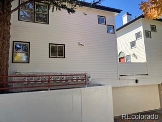 133 South Jackson Street, Unit A6 Denver, CO 80209 - Photo 19 of 19 a view of a brick house with many windows
