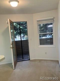 133 South Jackson Street, Unit A6 Denver, CO 80209 - Photo 10 of 19 a view of a livingroom with wooden floor and a window