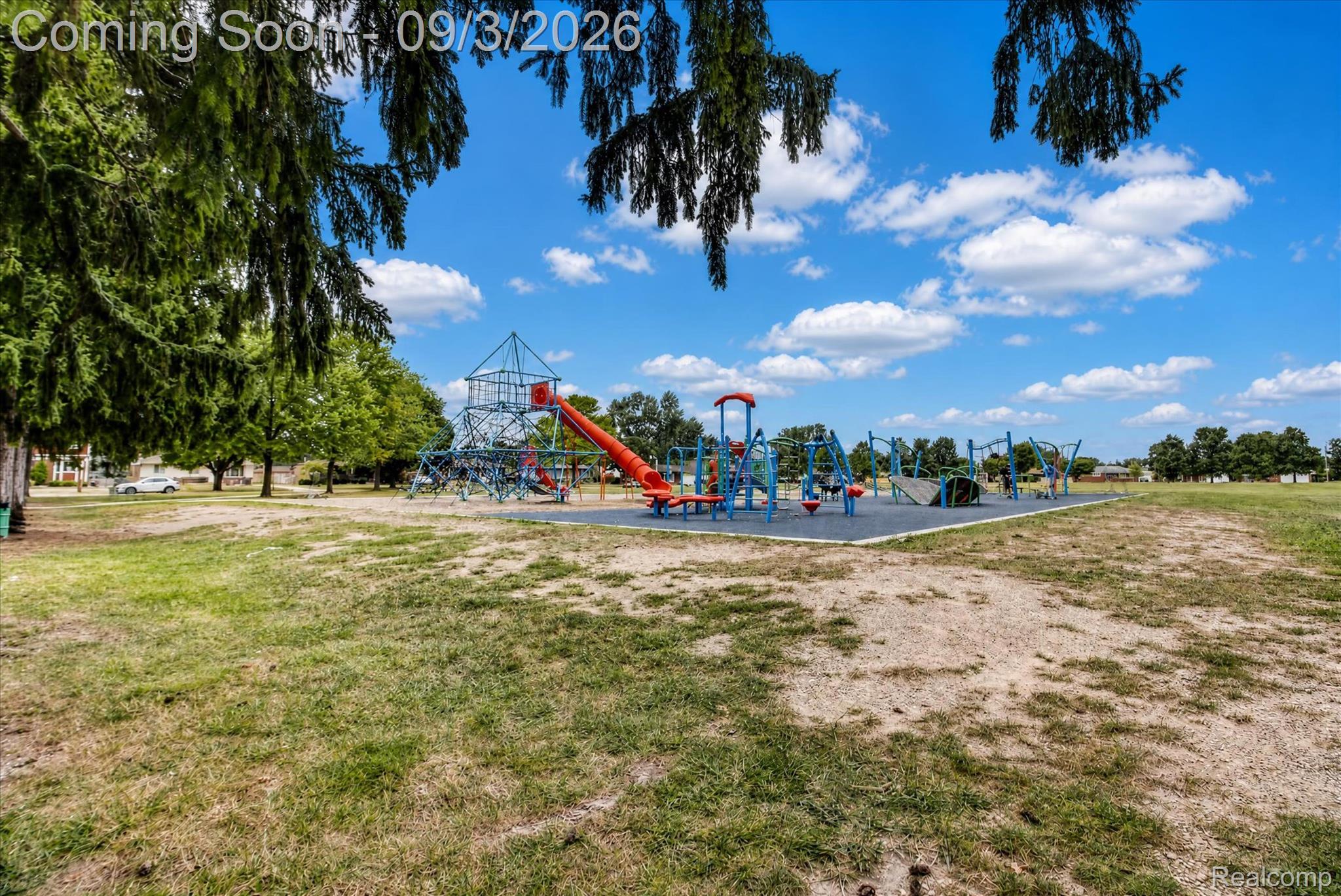 27260 Campbell Road Warren, MI 48093 - Photo 57 of 60 Outdoor recreational area featuring a large playground with multiple structures, a slide, swings, and a climbing apparatus