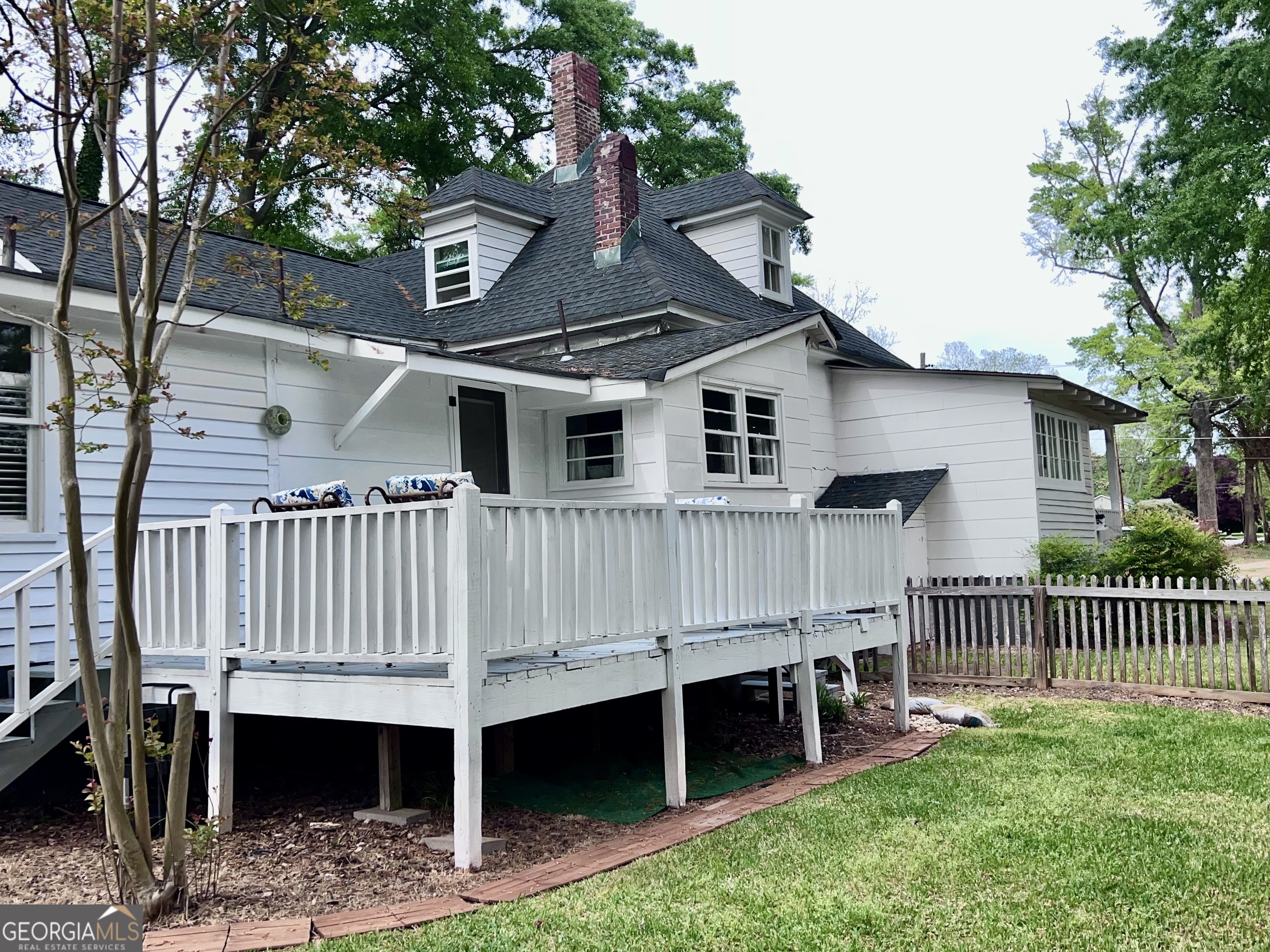 600 Foster Street Madison, GA 30650 - Photo 47 of 54 a view of a house with a yard and deck
