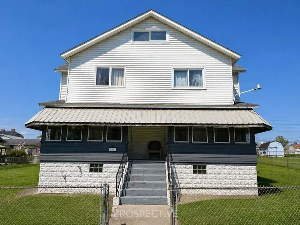 a front view of a house with garage