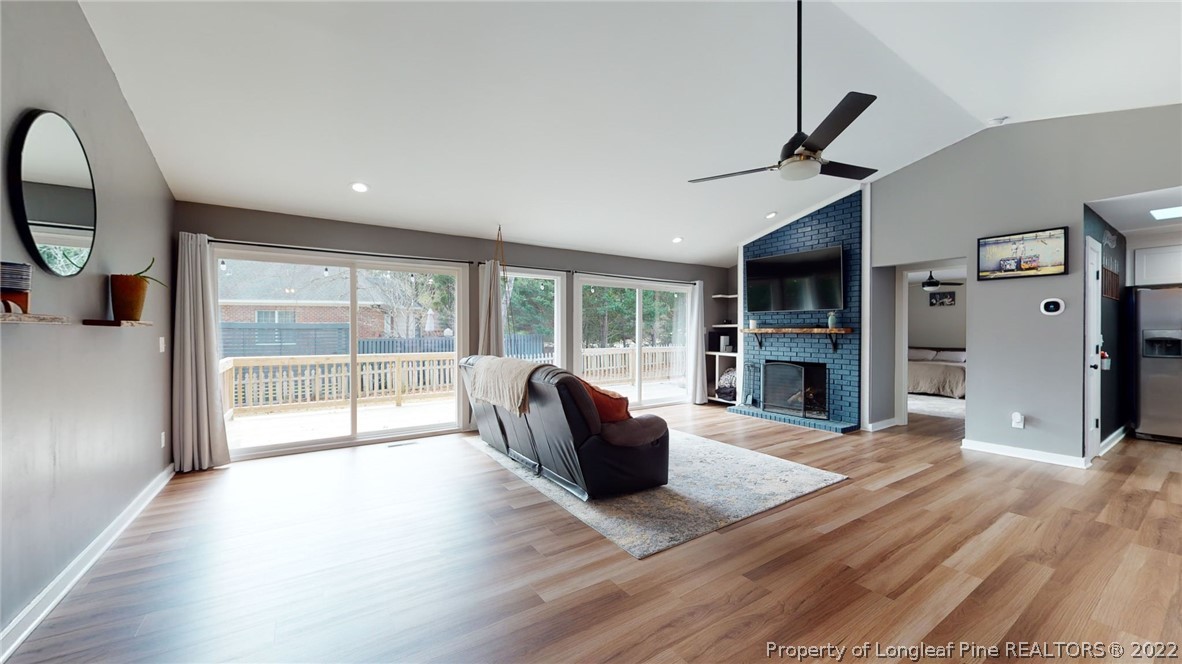 680 Burning Tree Road Pinehurst, NC 28374 - Photo 11 of 43 a living room with furniture and a fireplace