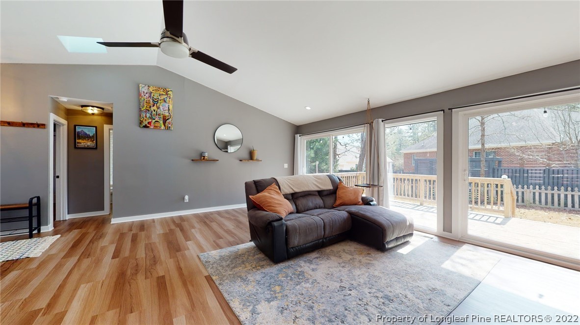 680 Burning Tree Road Pinehurst, NC 28374 - Photo 14 of 43 a living room with furniture and a large window