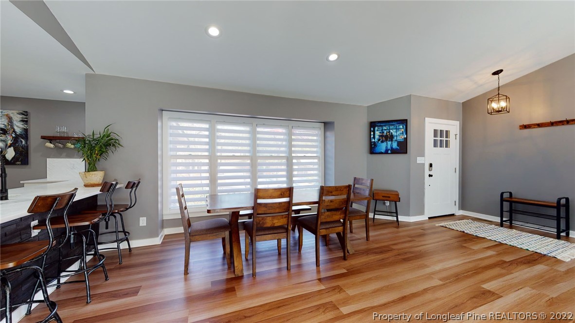 680 Burning Tree Road Pinehurst, NC 28374 - Photo 15 of 43 a view of a dining room with furniture window and wooden floor