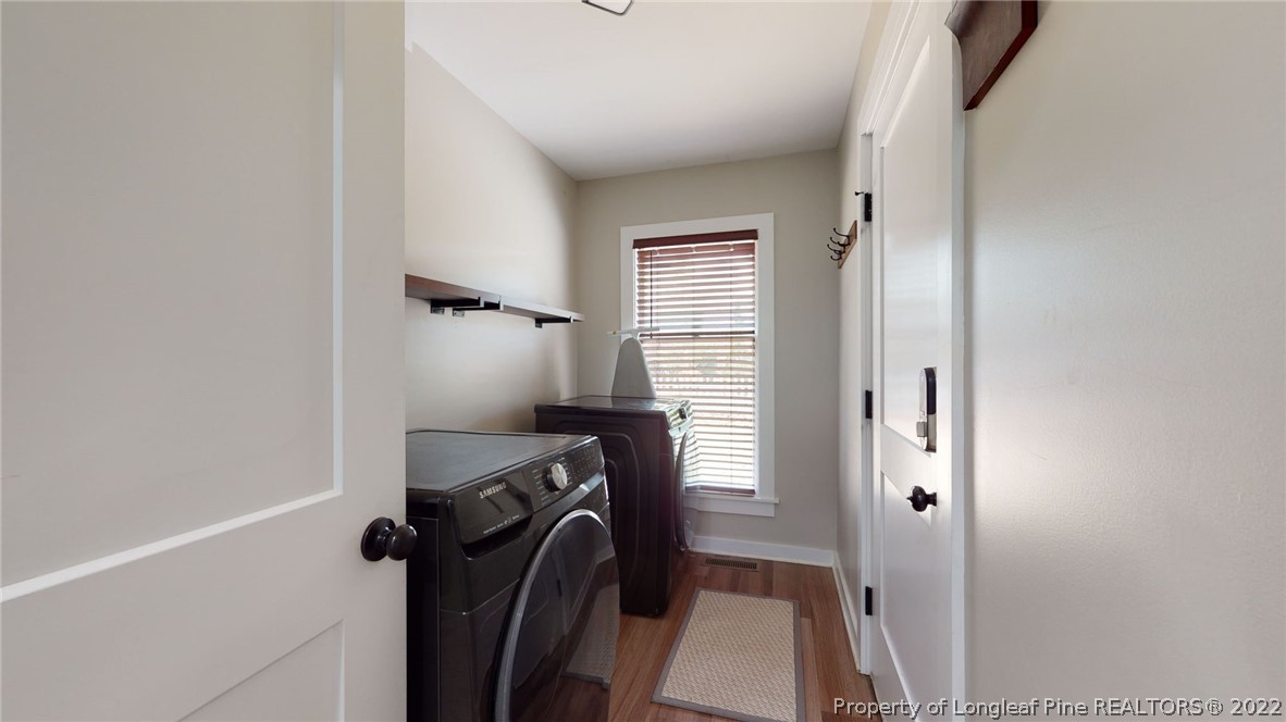 680 Burning Tree Road Pinehurst, NC 28374 - Photo 22 of 43 a view of storage and utility room with a washer dryer