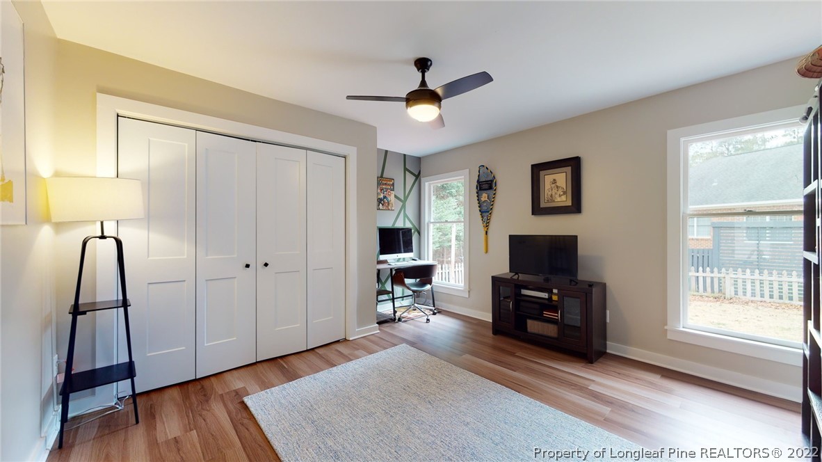 680 Burning Tree Road Pinehurst, NC 28374 - Photo 27 of 43 a living room with furniture and a flat screen tv