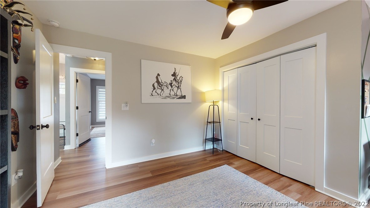 680 Burning Tree Road Pinehurst, NC 28374 - Photo 28 of 43 a view of a hallway with wooden floor and closet area