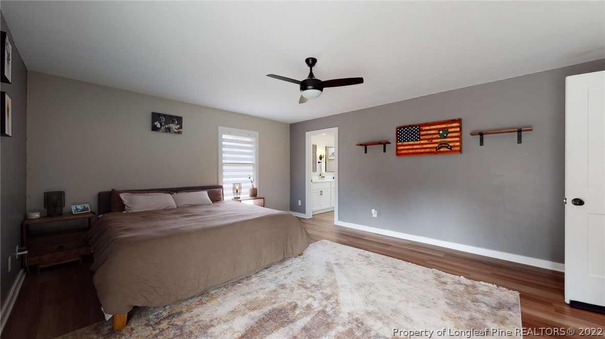 680 Burning Tree Road Pinehurst, NC 28374 - Photo 29 of 43 a bedroom with a bed and a window