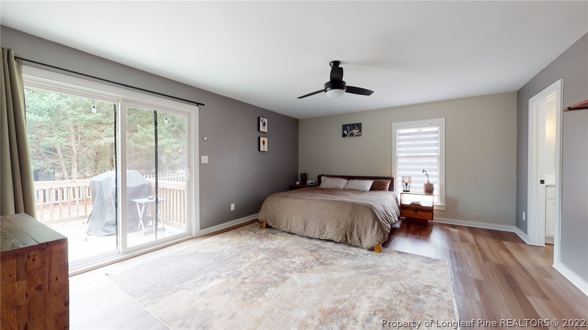 680 Burning Tree Road Pinehurst, NC 28374 - Photo 30 of 43 a bedroom with a large bed and a large window