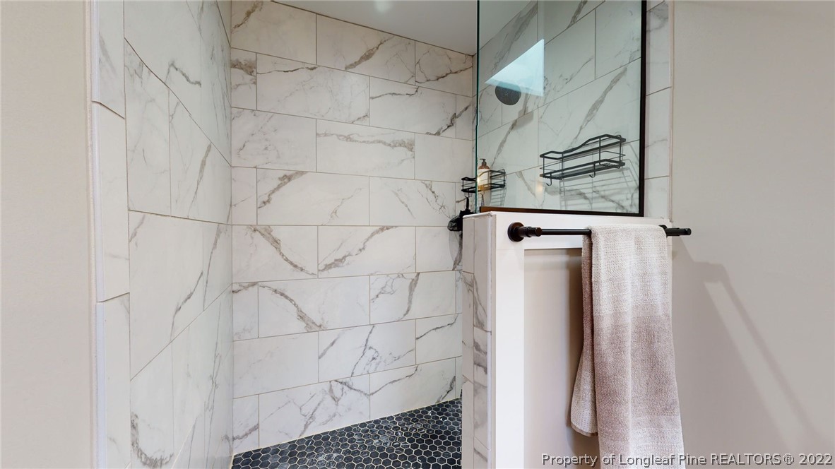 680 Burning Tree Road Pinehurst, NC 28374 - Photo 32 of 43 a bathroom with a shower