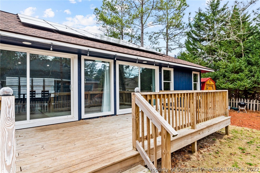 680 Burning Tree Road Pinehurst, NC 28374 - Photo 39 of 43 a view of porch with wooden floor and outdoor seating