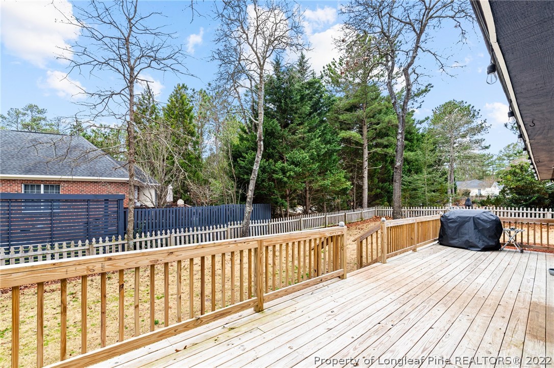 680 Burning Tree Road Pinehurst, NC 28374 - Photo 40 of 43 a view of balcony with wooden floor and fence
