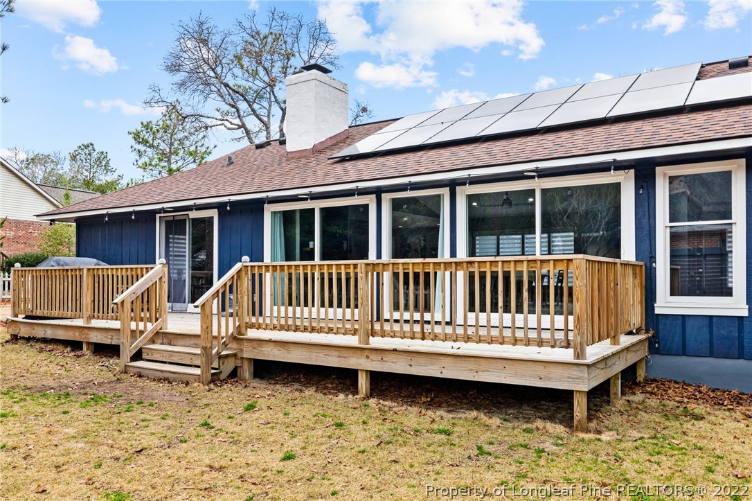 680 Burning Tree Road Pinehurst, NC 28374 - Photo 42 of 43 a view of a house with a wooden deck