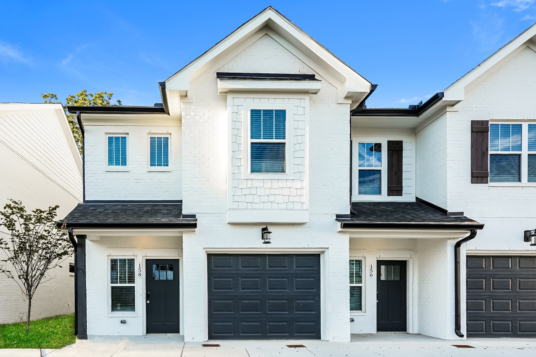 a front view of a house with glass windows