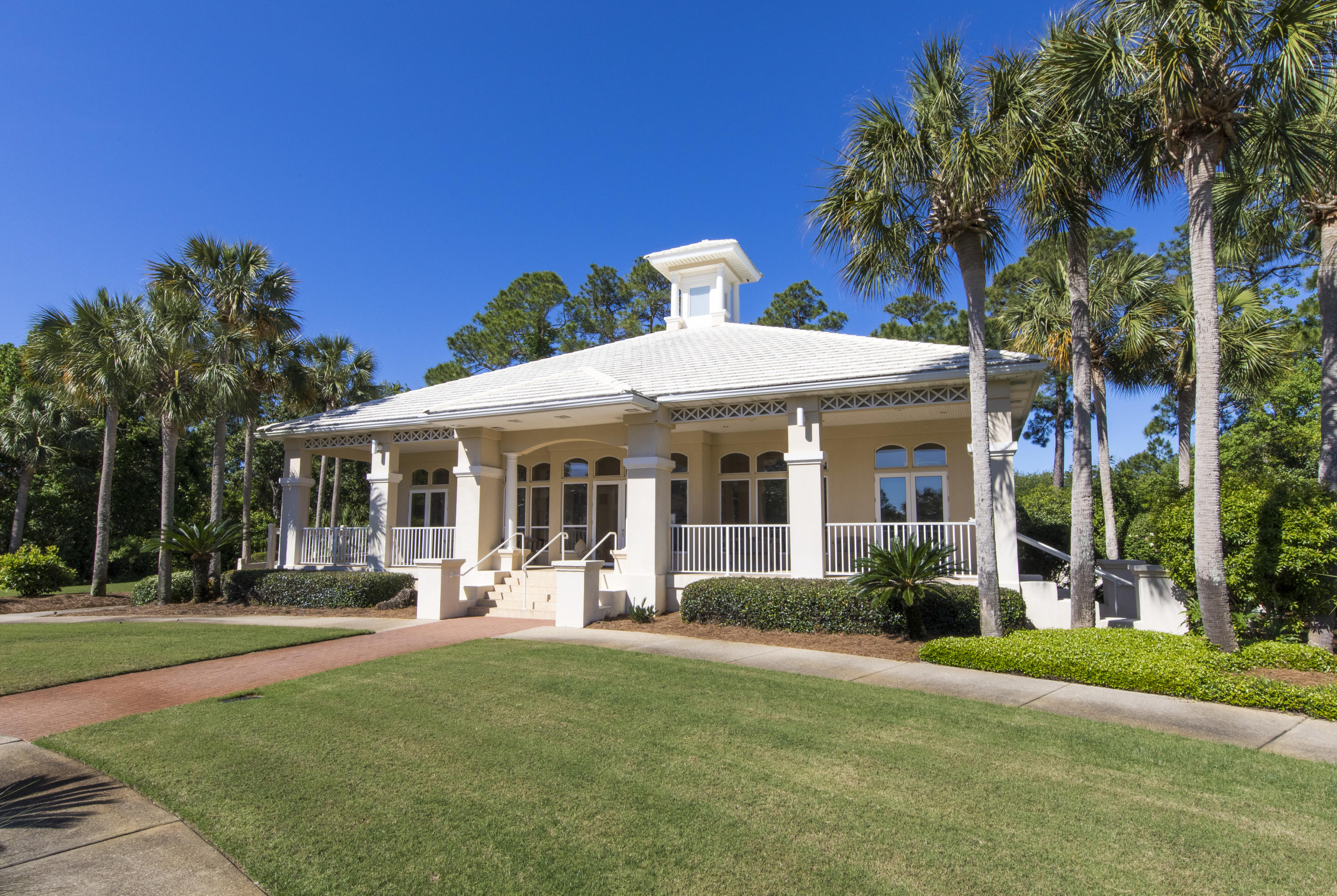 Lot 7 White Cliffs Drive Santa Rosa Beach, FL 32459 - Photo 7 of 12 a front view of a house with a yard table and chairs