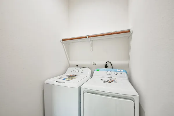 a kitchen with a sink a stove and cabinets