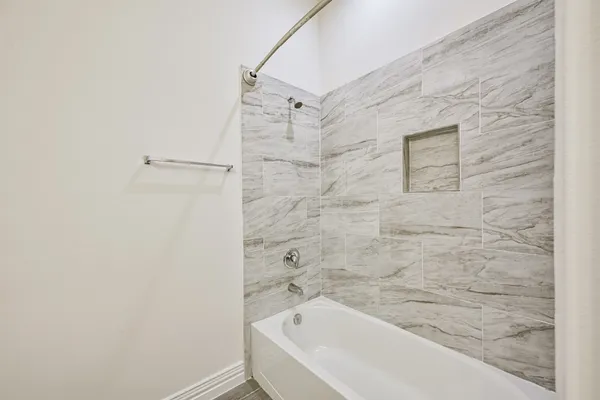 a bathroom with a granite countertop sink a toilet and a mirror