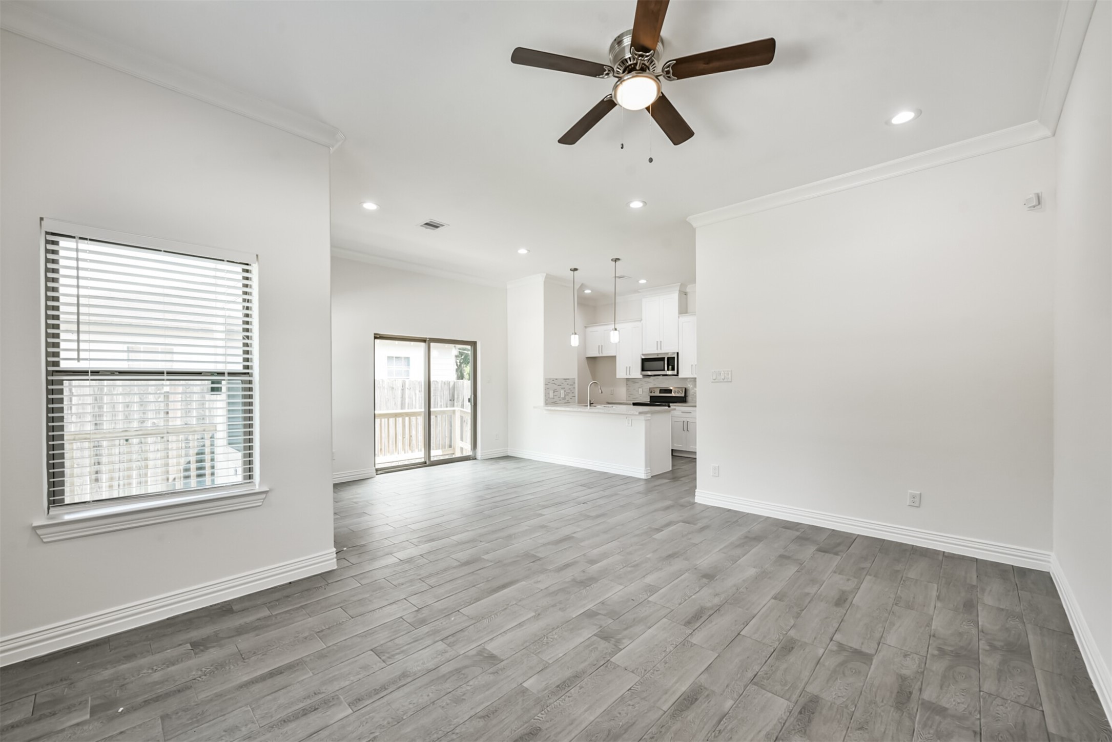 5114 Higgins Street, Unit A Houston, TX 77033 - Photo 7 of 28 a view of a kitchen with a sink and wooden cabinet