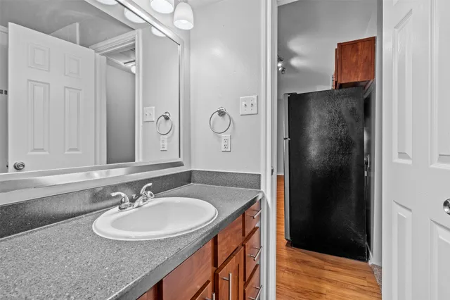 a bathroom with a sink double vanity and shower