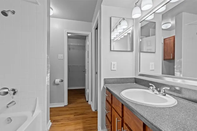 a bathroom with a bathtub and shower