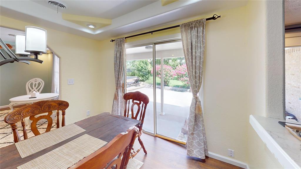 202 River Oaks Road Early, TX 76802 - Photo 14 of 37 a view of a dining room with furniture window and wooden floor