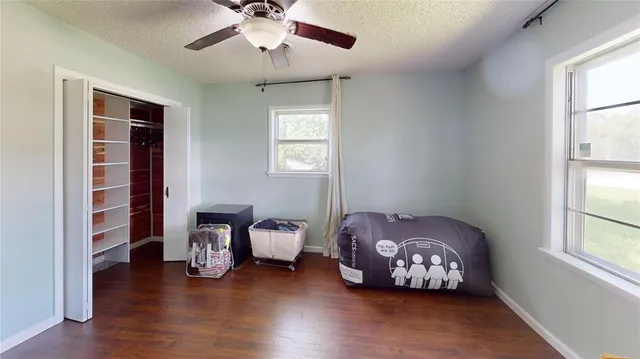 a bed room with furniture and a window