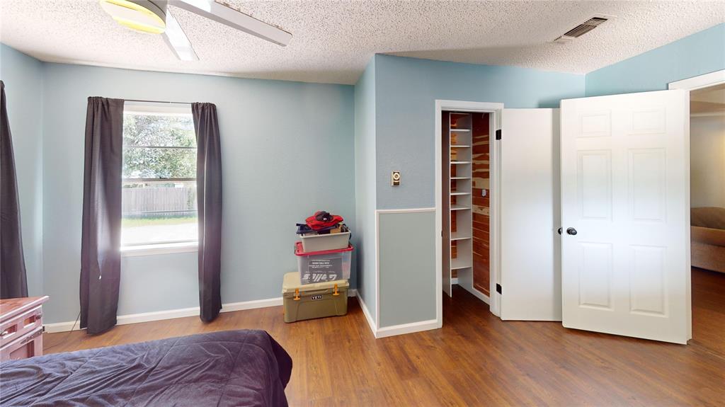 202 River Oaks Road Early, TX 76802 - Photo 22 of 37 a bedroom with a bed and a window