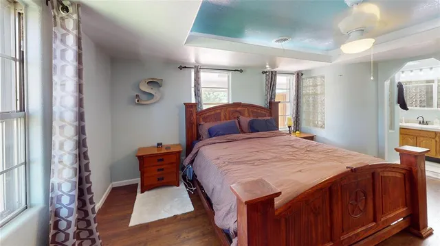 a bedroom with a bed and a mirror