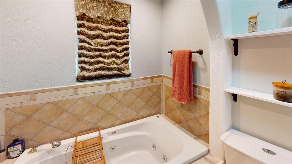 202 River Oaks Road Early, TX 76802 - Photo 27 of 37 a bathroom with a bathtub and shower