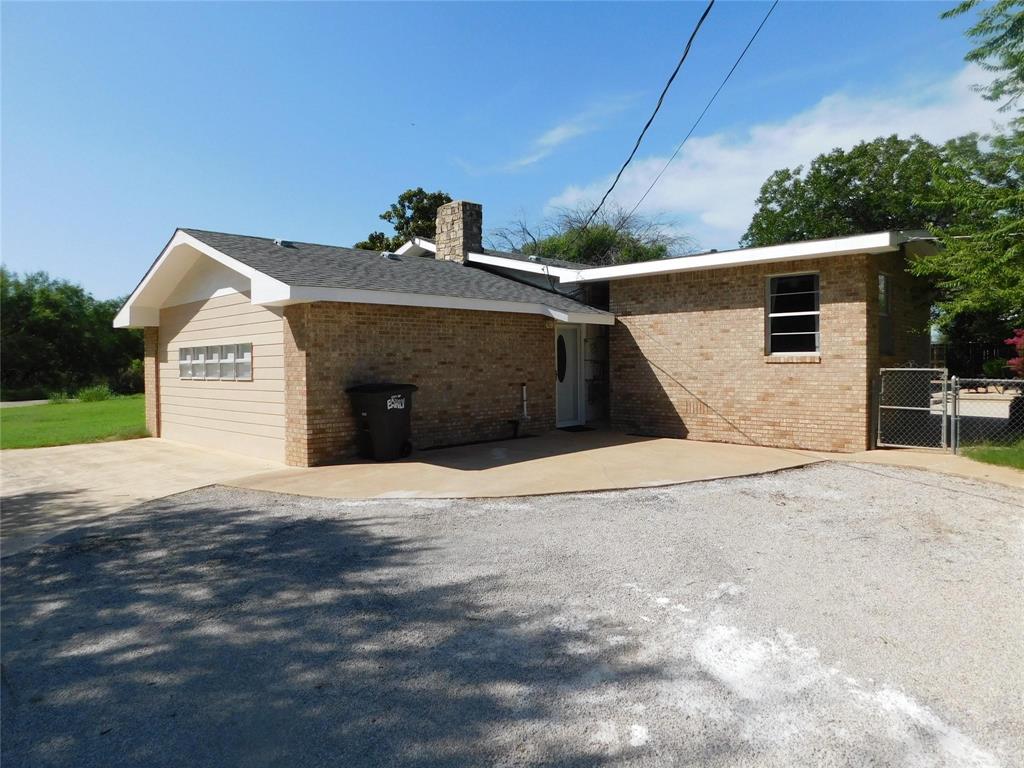 202 River Oaks Road Early, TX 76802 - Photo 33 of 37 a front view of a house with a yard