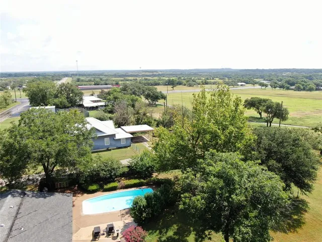an aerial view of a house with lake view and city view