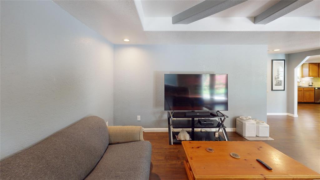 202 River Oaks Road Early, TX 76802 - Photo 5 of 37 a living room with furniture and a flat screen tv