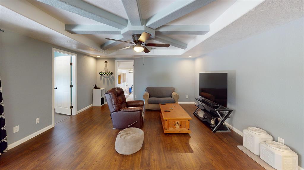 202 River Oaks Road Early, TX 76802 - Photo 6 of 37 a view of a livingroom with furniture and a flat screen tv