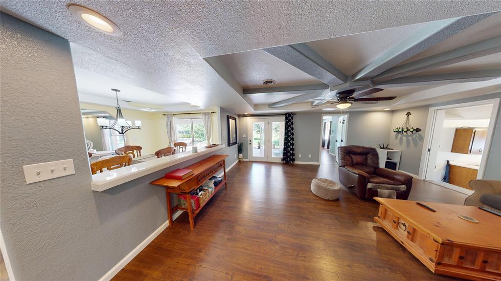 202 River Oaks Road Early, TX 76802 - Photo 7 of 37 a living room with furniture and a wooden floor