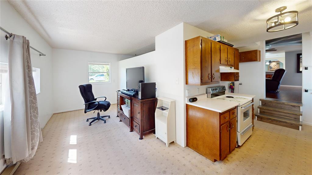 202 River Oaks Road Early, TX 76802 - Photo 10 of 37 a view of kitchen with windows and refrigerator