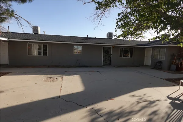a backyard of a house with wooden fence