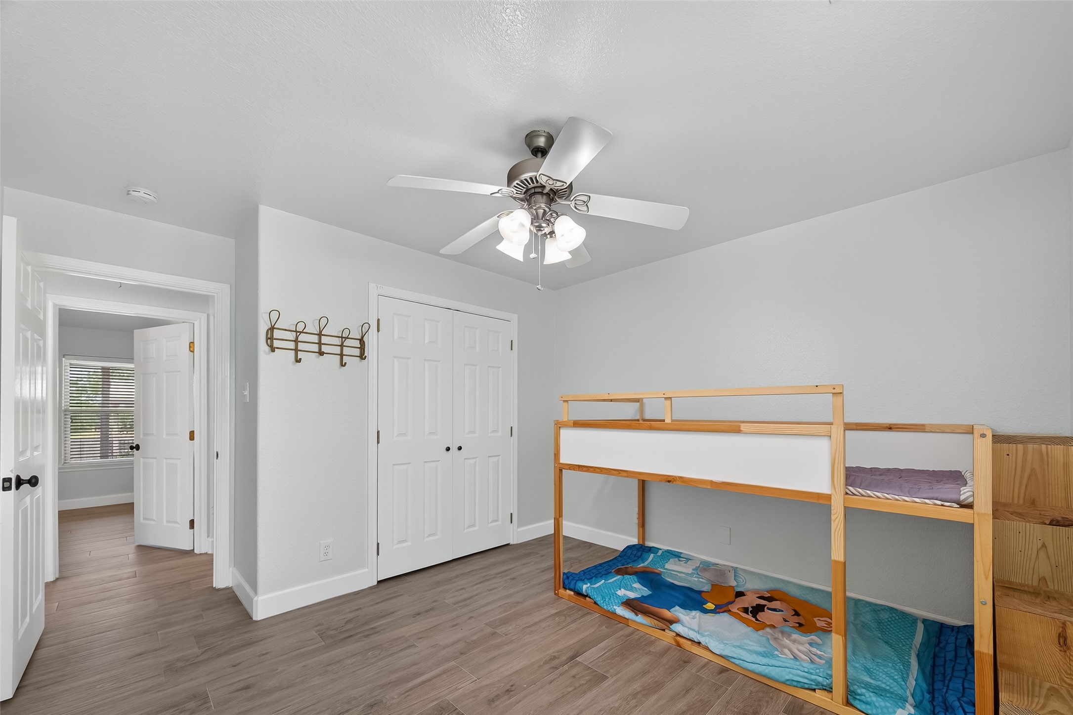 1030 Ginger Street Santa Fe, TX 77517 - Photo 19 of 50 a room that has a bed and a chandelier