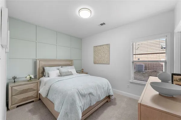 a bedroom with a bed and a couch