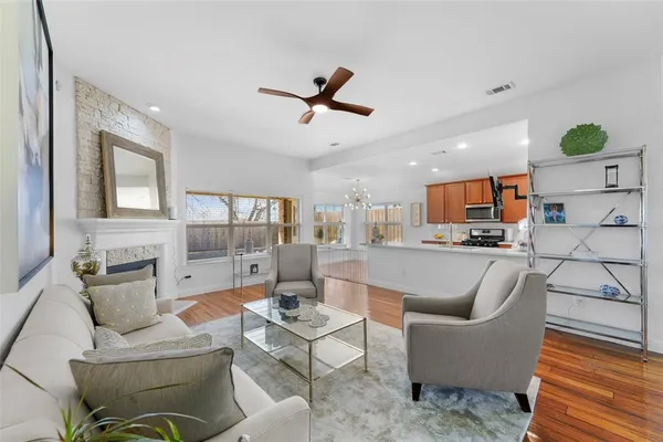 a living room with furniture and kitchen view