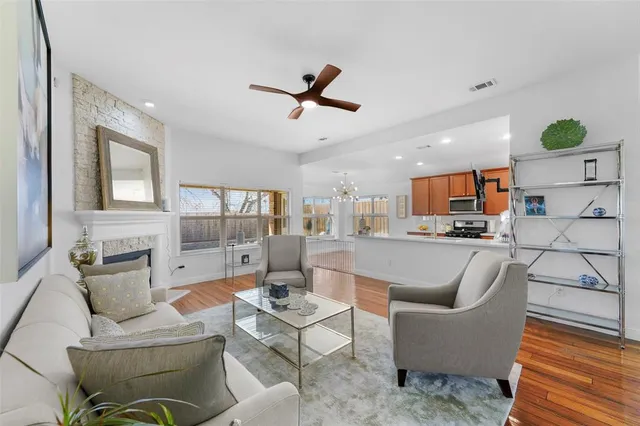 a living room with furniture and kitchen view