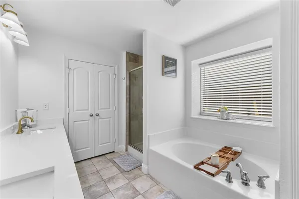 a bathroom with a bathtub and a sink