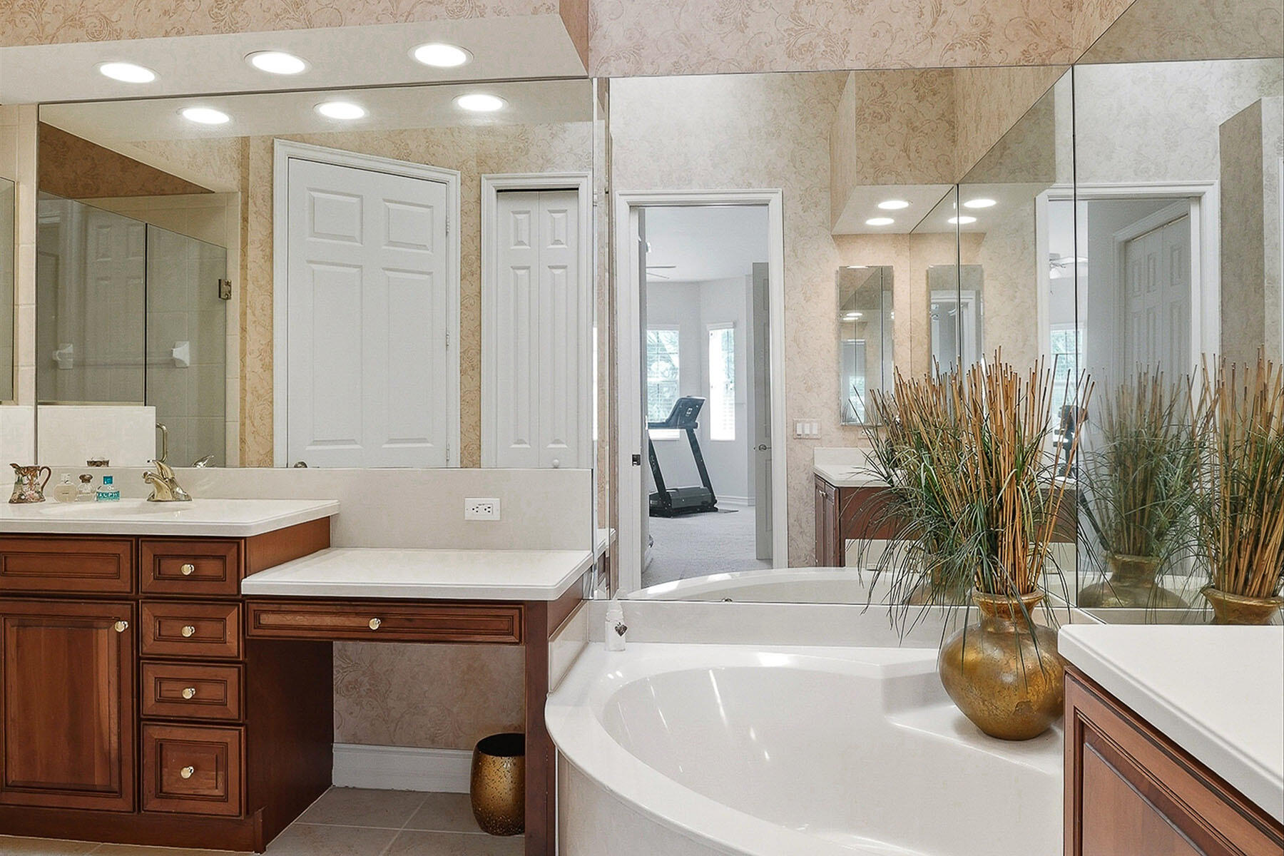 8605 Champions Point, Unit 103 Naples, FL 34113 - Photo 28 of 44 a bathroom with a tub sink and mirror