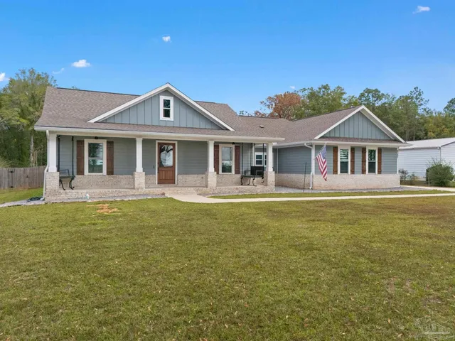 a view of a small space with wooden floor and a window
