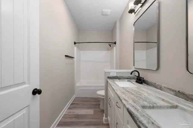 a front view of a house with a swimming pool