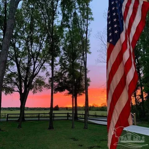 a view of a street with a building in the background