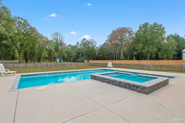 a view of a yard with an outdoor space and hardwood