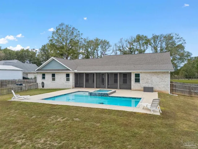 an aerial view of residential house with outdoor space